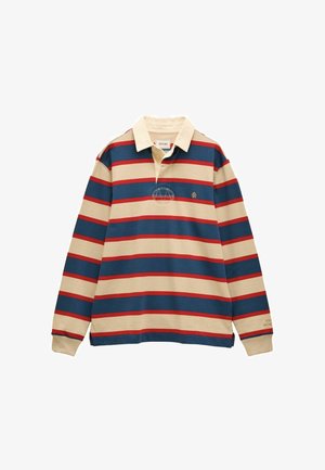 Raidallinen pitkähihaisen polo-paita, jossa värit kerma, laivastonsininen ja punainen. Sisältää kauluksen, nappikiinnityksen, sivusplitit ja kirjailtua logoa rinnassa.