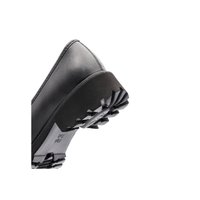 Black leather shoe angled to show rugged, thick rubber sole with deep treads for enhanced grip and durability.