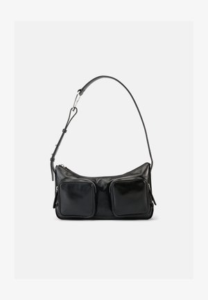 Black leather shoulder bag with adjustable strap and two large front zippered pockets on a plain light background.