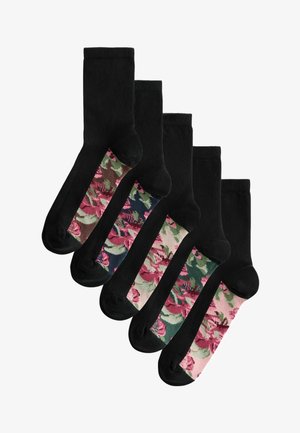 Set of five black socks with floral pattern accents in various colors on the mid-calf section. Cotton material, casual design.