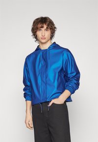 Rains - STRING JACKET UNISEX - Sadetakki - storm Pienoiskuva 1