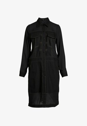 Black long-sleeve knee-length dress with front button closure, collar, chest flap pockets, and contrasting orange stitching details.
