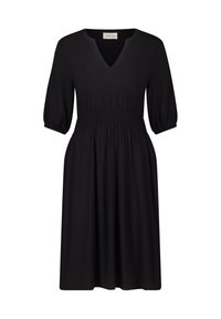 Schwarzes Kleid mit V-Ausschnitt, kurzen Puffärmeln und smockiertem Taillenbund. Hergestellt aus weichem Stoff, mit fließender A-Linie.