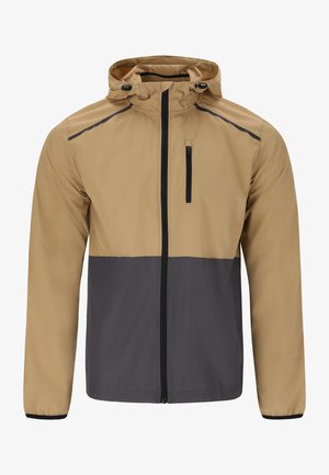 Let jakke med en beige overdel og mørkegrå underdel. Har en lynlås foran, justerbar hætte og lynlåslomme på brystet.