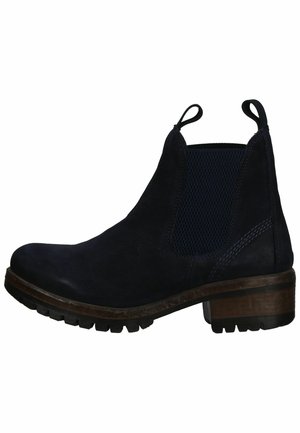 Bottines en suède bleu marine avec panneaux latéraux élastiques, languettes de tirage et semelle en caoutchouc texturé. Le talon en bois ajoute un contraste distinct.