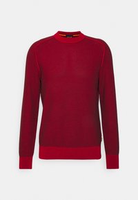 Roter Strickpullover mit strukturiertem Muster, rundem Ausschnitt sowie gerippten Bündchen an Ärmeln und Saum. Mit kontrastierenden, dunkler roten Raglanärmeln.