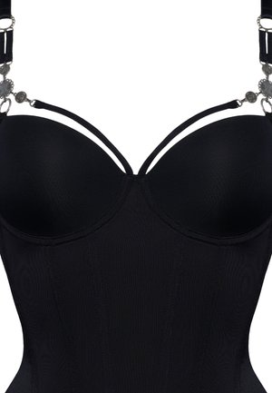 Black corset with molded cups, adjustable straps, and decorative silver hardware. Features textured fabric with vertical seams.