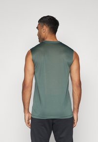 Nike Performance TEE RESET - Top - vintage green/matte silver