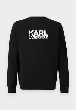 Czarna bluza crewneck z długimi rękawami i białym napisem "KARL LAGERFELD" umieszczonym na środku klatki piersiowej.