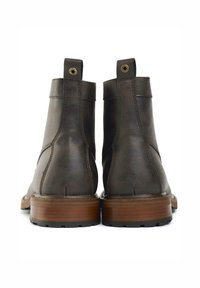 Brown leather ankle boots with a smooth texture, featuring a rounded toe, stitched detailing, and a sturdy wooden heel.