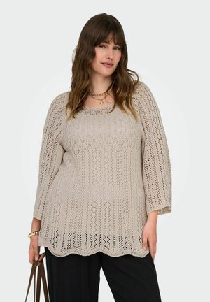 Beige crochet top with a wide neckline, three-quarter sleeves, and a scalloped hem. Features a patterned texture with open stitching.