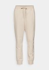 ICONS CUFF PANTS LARGE LOGO - Spodnji deli trenirk - beige
