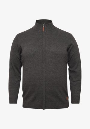 Tamsiai pilkas megztinis su aukštu apykakle, visiškai užtrauktuku, išilgai raukšlėtomis rankovėmis ir odiniu akcentu su ženklu apatiniame šone.