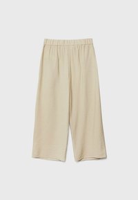 Pantalons beige à jambes larges avec une taille élastique, fabriqués à partir d'un tissu léger et texturé, présentant une longueur raccourcie et une finition lisse.