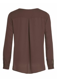 Långärmad blus med bakvy i djupbrun tyg. Har rund halsringning, plissering bak och knäppta manschetter. Slät textur.