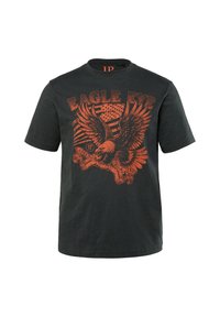 Zwarte katoenen T-shirt met korte mouwen, voorzien van een grote oranje adelaarafbeelding. Boven staat de tekst "EAGLE EYE" en onder "FREEDOM FROM FEAR".