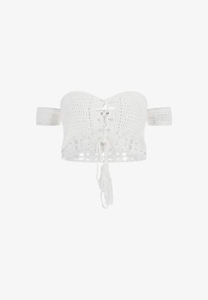 Haut bandeau en crochet blanc avec un devant à lacets, un dos ouvert et des détails en franges. Présente des bretelles larges pour un meilleur maintien et un motif texturé.