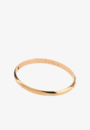 Kullatooni metallist käevõru, millele on graveeritud "FURLA 1927" ning kaunistatud väikeste läbipaistvate kristallidega, kinnitusega sulguriga.