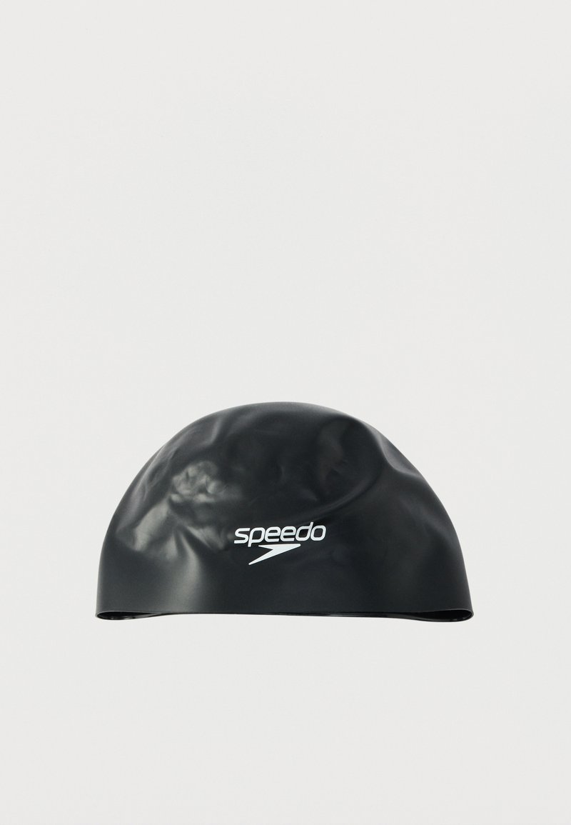 Black silicone swim cap with a smooth, glossy texture, featuring a white Speedo logo on the front. Rounded shape, designed for water resistance.