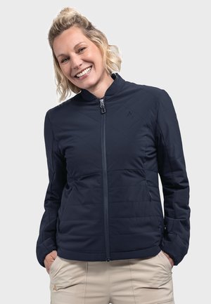Marineblauer gesteppter Mantel mit Stehkragen und Reißverschluss, ausgestattet mit seitlichen Taschen und einem leichten, strukturierten Stoff.