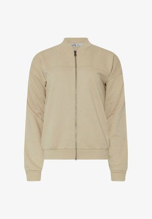 Vaaleanbeige bomber-takki, joka on valmistettu pehmeästä materiaalista. Siinä on vetoketjukiinnitys, ribbaustaskut ja yksinkertainen, selkeä muotoilu ilman kuvioita.