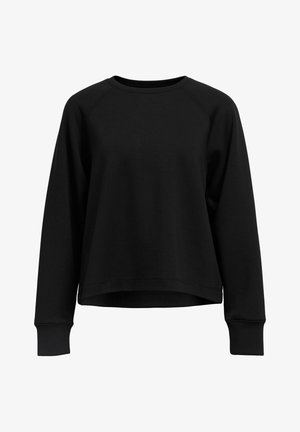 Crna dukserica s dugim raglan rukavima, okruglim izrezom i blago skraćenim rubom. Izrađena je od meke mješavine pamuka s glatkom teksturom.