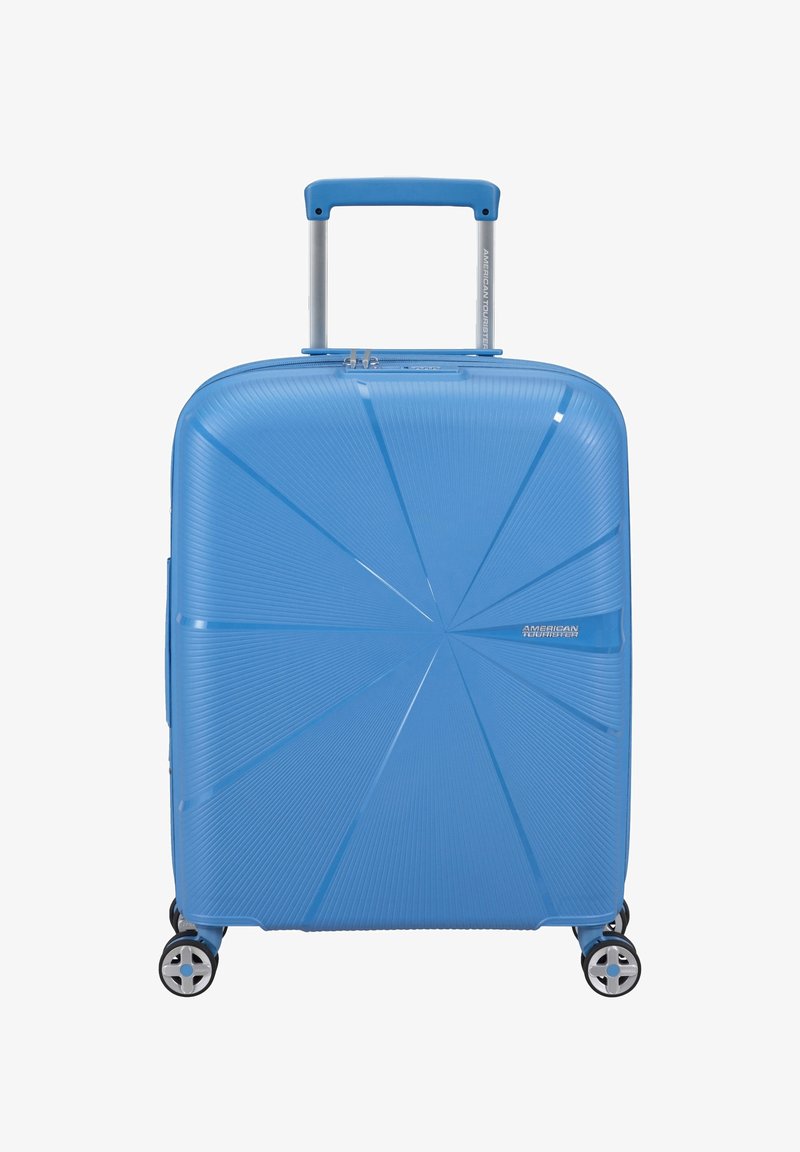 Valigia rigida blu, con un pattern geometrico testurizzato, manico retrattile e quattro ruote piroettanti per una facile manovrabilità.