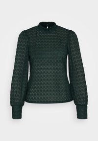 Mörkgrön blus med strukturerat mönster, hög hals och lång puffärmar. Har subtila detaljer och en nyckelhålsknäppning i ryggen.