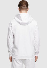 Merchcode NOW OR NEVER BASIC - Hoodie - white