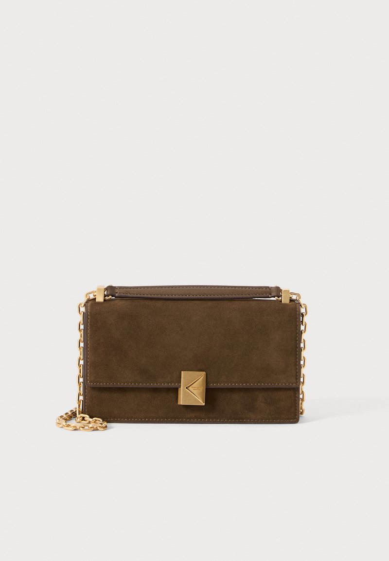 Brown suede crossbody bag with a gold chain strap, rectangular shape, front flap with a geometric metal clasp, and smooth leather accents.