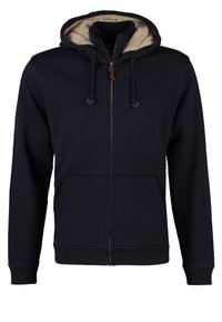 Felpa con zip di colore blu navy, dotata di tasche frontali, cappuccio con cordino e rivestimento in pile beige all'interno del cappuccio e del colletto.