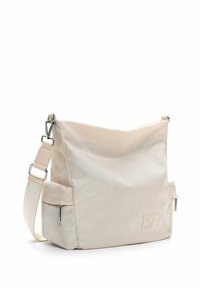 Beige shoulder bag made of textured material, featuring a zipper closure, adjustable strap, and a small zippered exterior pocket.
