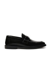 Black patent leather loafers with a rounded toe, decorative strap, and textured stitching on the upper. Smooth, shiny finish. Flat sole.