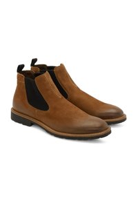 Bottes Chelsea en cuir marron avec des panneaux élastiques noirs sur les côtés et des languettes de tirage, bout rond et semelle en caoutchouc texturée. Détails cousus aux coutures.