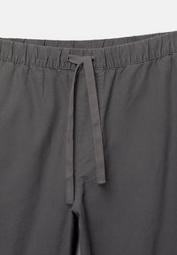 Grau elastische Hose aus leichtem Stoff, mit einem Kordelzug und einer subtilen Textur.
