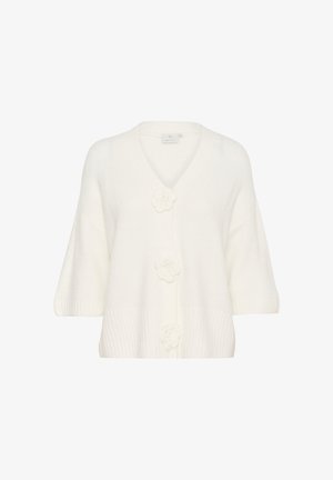 White cardigan made of soft knit material, featuring a V-neck, short sleeves, and three floral button details. Ribbed texture at the hem.