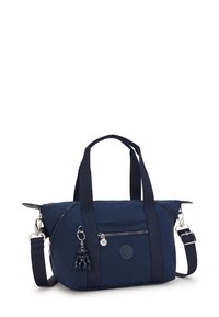 Navy blue tote bag made from durable nylon, featuring double handles, adjustable shoulder strap, front zipper pocket, and rubber logo accent.
