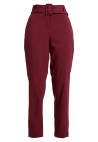 Burgundy high-waisted trousers with a wide belt and buckle. Features a smooth texture and tapered legs with side pockets.