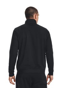 Black zip-up sweatshirt with long sleeves and a high collar, featuring a smooth texture and elastic cuffs and hem. Visible stitching details.