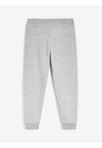 Pantalons de survêtement gris en tissu doux, équipés d'une taille élastique et de poignets côtelés aux chevilles, avec une texture lisse et un design simple.