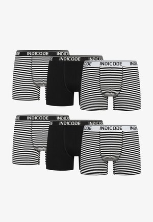 Zes paar herenslipjes, met een ontwerp in effen zwart en zwart-wit gestreept, met gegolfde elastische taillebanden van het merk.