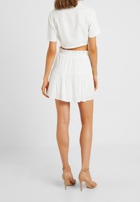 Honey Punch Áčková sukně - white