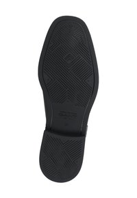 Sole nera di una scarpa con un design in gomma testurizzata e motivi geometrici, comprese accentuazioni in rilievo e un'impronta del logo. Misura 37.