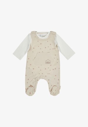 Cremefarbener Baby-Overall mit Füßchen, langen weißen Ärmeln, kleinem Pfotenabdruck-Muster und einer Vordertasche mit einer gestickten Welpen-Gesichtszeichnung.