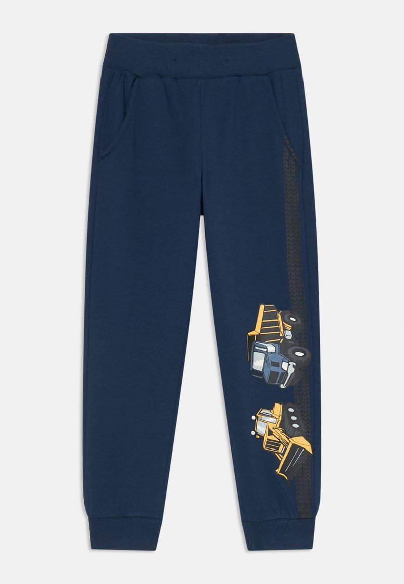 Navyblauwe joggingsbroek van zacht materiaal, met zijzakken en afgebeelde gele bouwvoertuigen langs het linkerbeen.