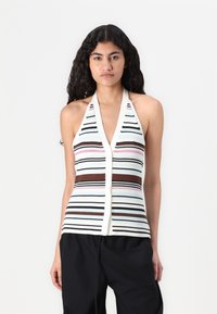 Halter-neck, sleeveless top features a ribbed texture with horizontal stripes in pastel colors, including pink, blue, and brown accents.