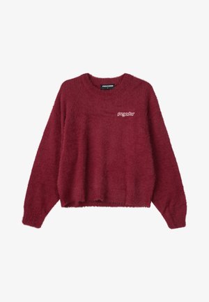 Burgundska pulover iz puhastega materiala, z okroglim izrezom in dolgimi rokavi. Na sprednji strani je majhen bel logo "pegador".
