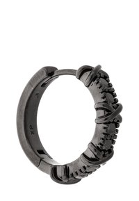 Schwarzer Metallring mit strukturiertem Design, das ineinandergreifende Elemente und ein glattes Innere aufweist. Auffällige geometrische Akzente um den Ring.