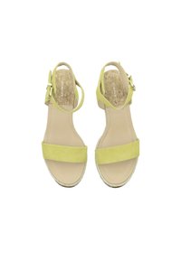Yellow suede sandals with two wide straps, adjustable ankle strap, and a cork footbed. Smooth surface and rounded edges.