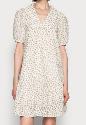 Vestito corto a fiori con maniche a sbuffo, colletto oversize appuntito e chiusura frontale con bottoni in tonalità chiare e neutre.